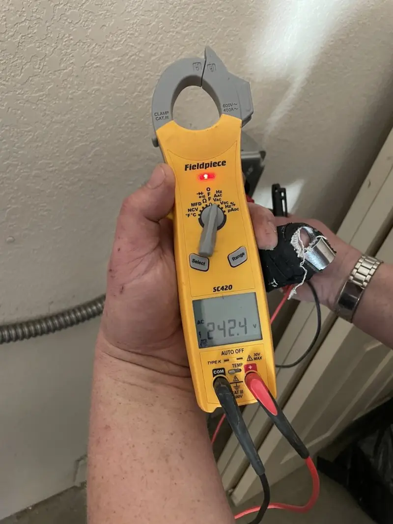 Voltage testing with clamp meter during Outlet Installation in Desert Edge